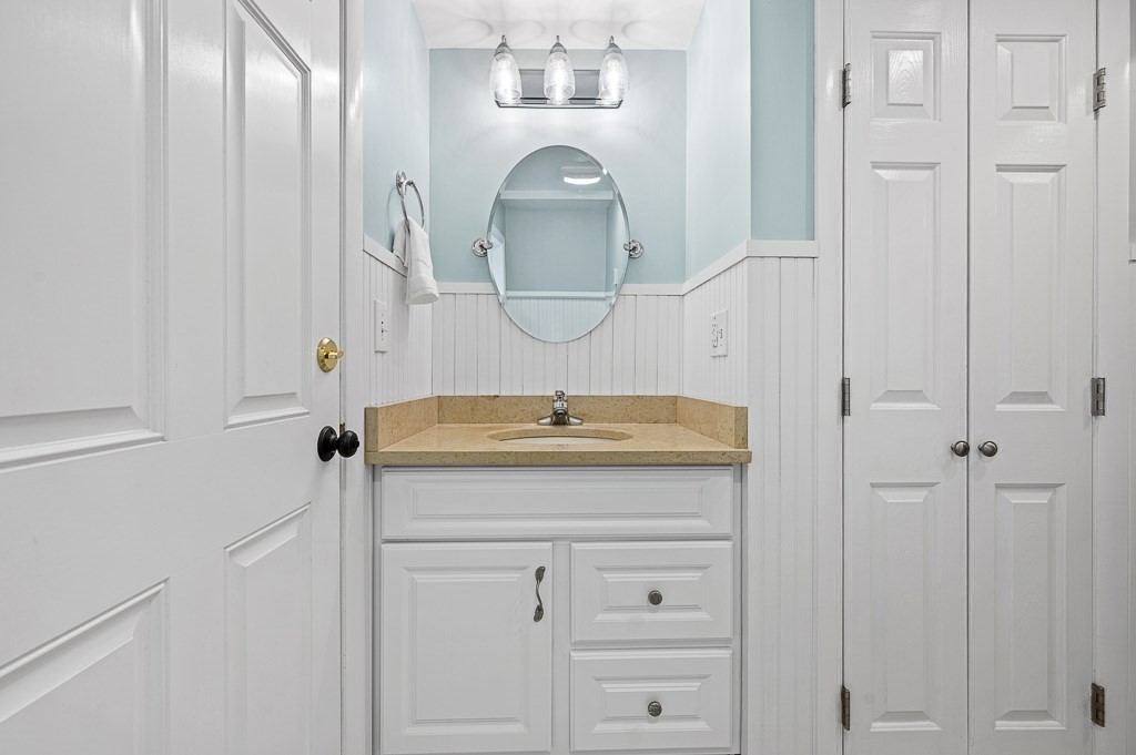 12 Sycamore Road Sudbury, MA 01776 - Photo 25 of 38 a bathroom with a sink and a mirror