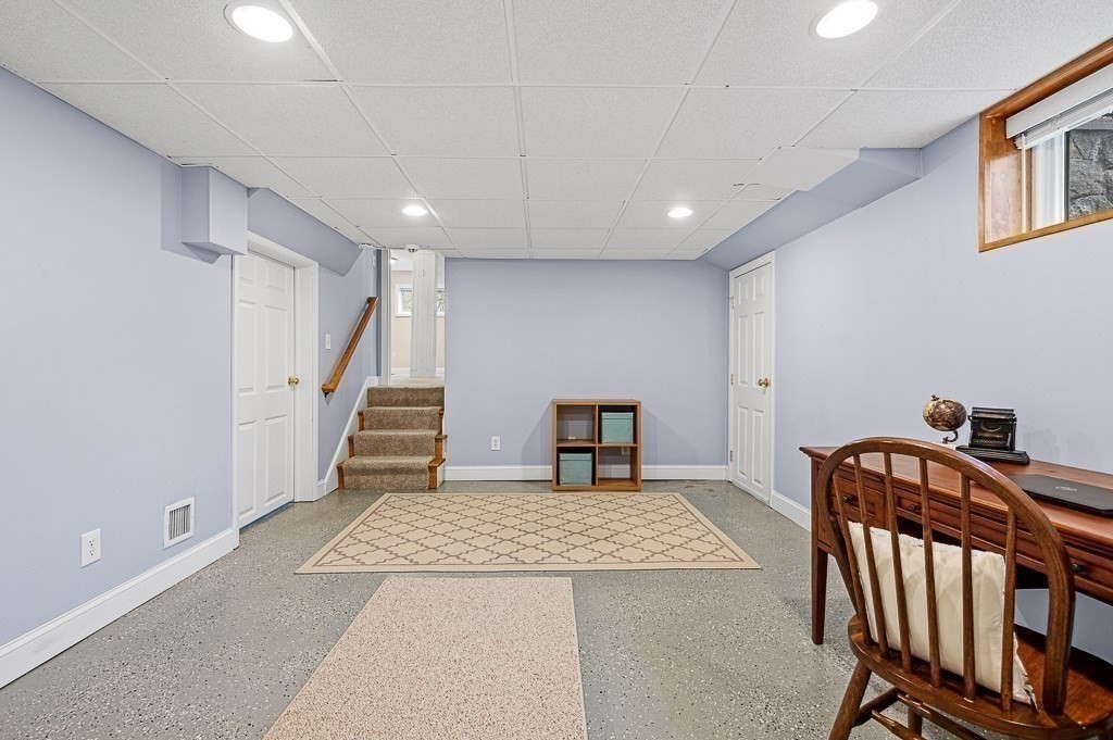 12 Sycamore Road Sudbury, MA 01776 - Photo 27 of 38 a view of a livingroom with wooden floor and stairs