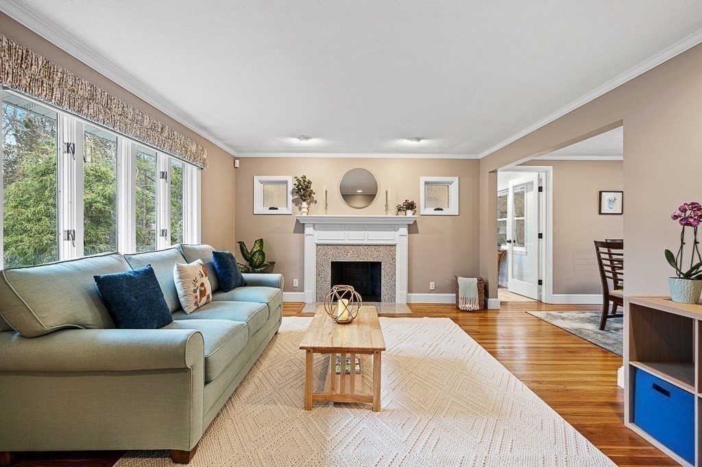 12 Sycamore Road Sudbury, MA 01776 - Photo 4 of 38 a living room with furniture and a fireplace