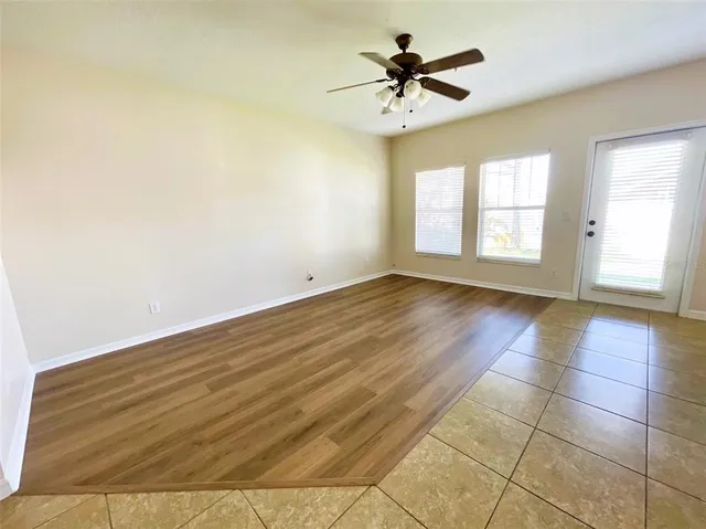 a view of an empty room with a window