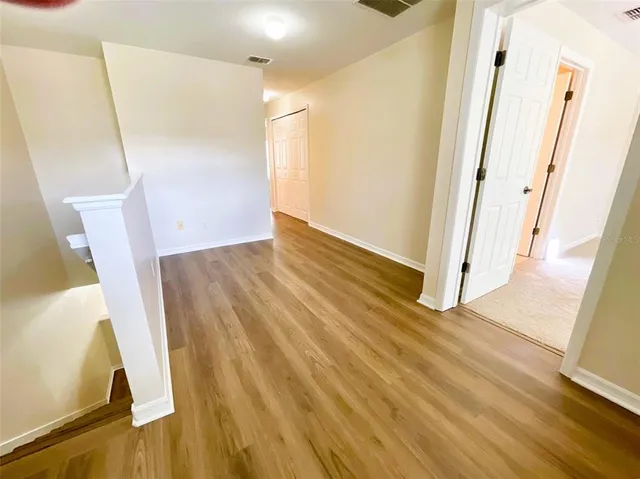 a view of front door and wooden floor