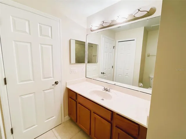 a bathroom with a sink double vanity and a mirror