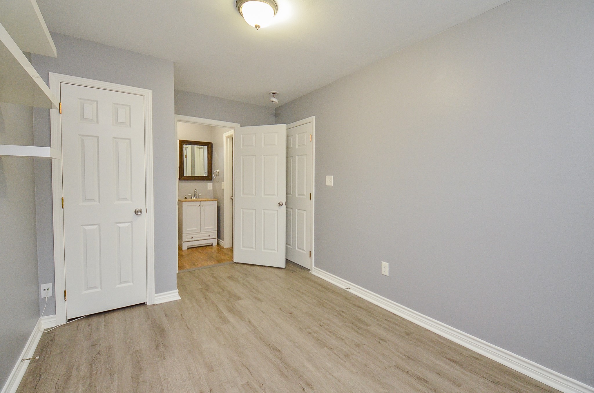 303 Vincent Street, Unit A Houston, TX 77009 - Photo 13 of 15 Bedroom with door leading to restroom and closet