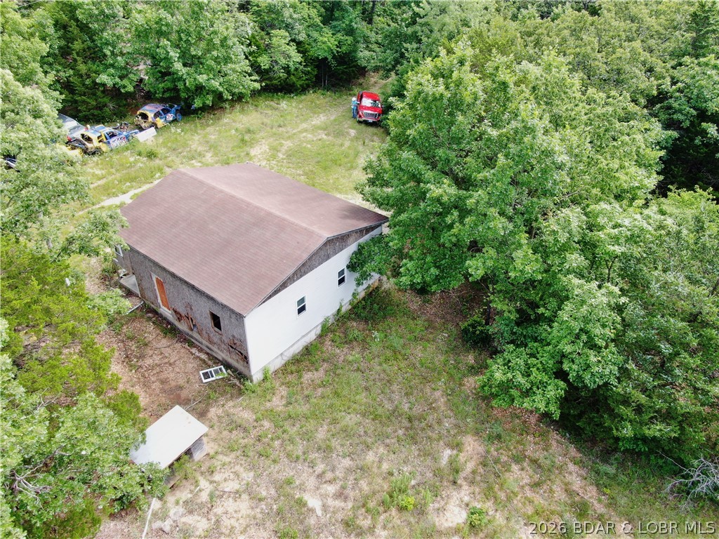 27 Puckett Road Eldon, MO 65026 - Photo 9 of 9 Old 2 Car Garage and well house to lower left.