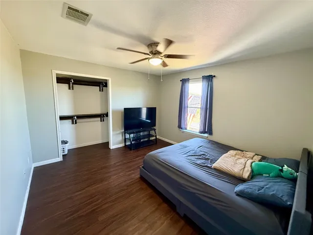 a bedroom with furniture and a window
