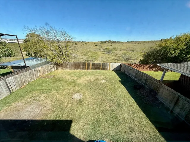 a view of a swimming pool and an outdoor seating