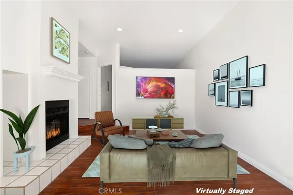 a living room with furniture and a fireplace