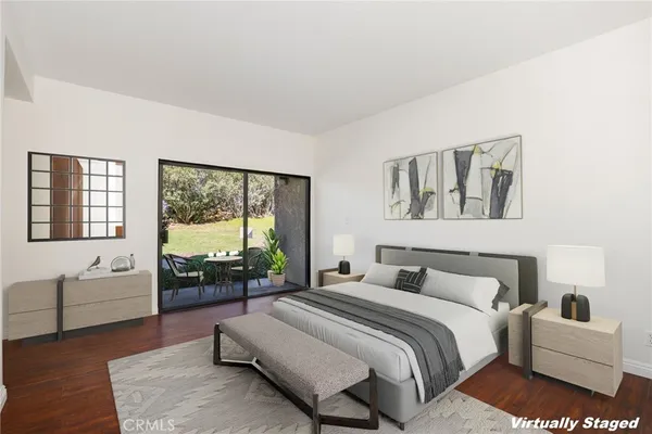 a bedroom with a large bed and a large window