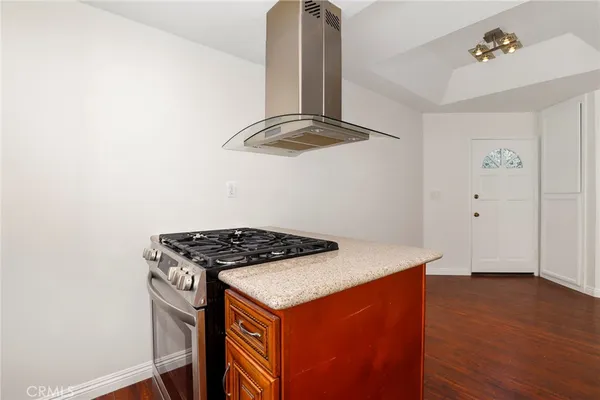 a kitchen with a stove and a refrigerator