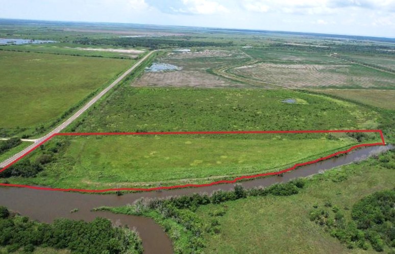 a view of a lake with a big yard