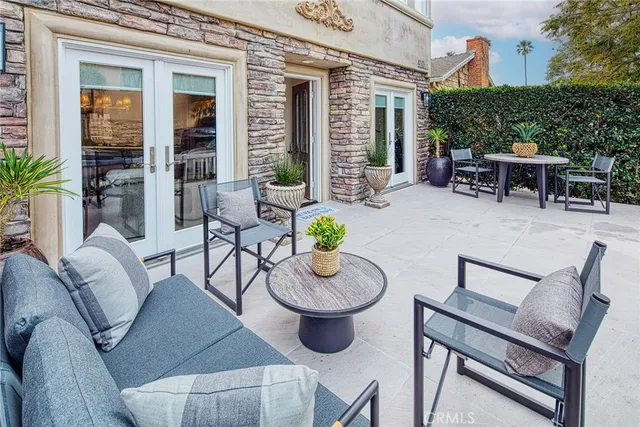 a view of a patio with couple of chairs
