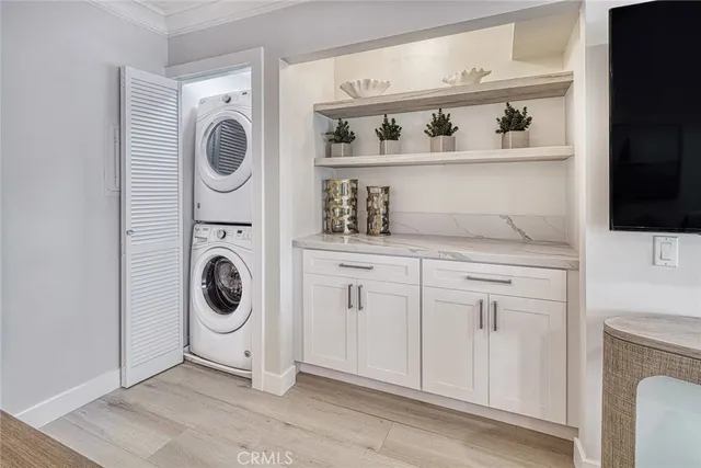 a utility room with sink dryer and washer