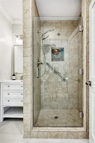 a bathroom with a shower and a sink