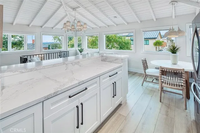 a view of a kitchen with furniture and windows