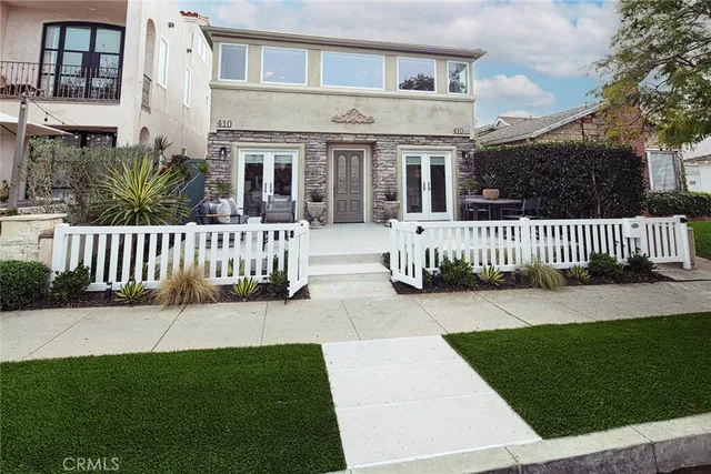 a view of a house with a yard and a garden