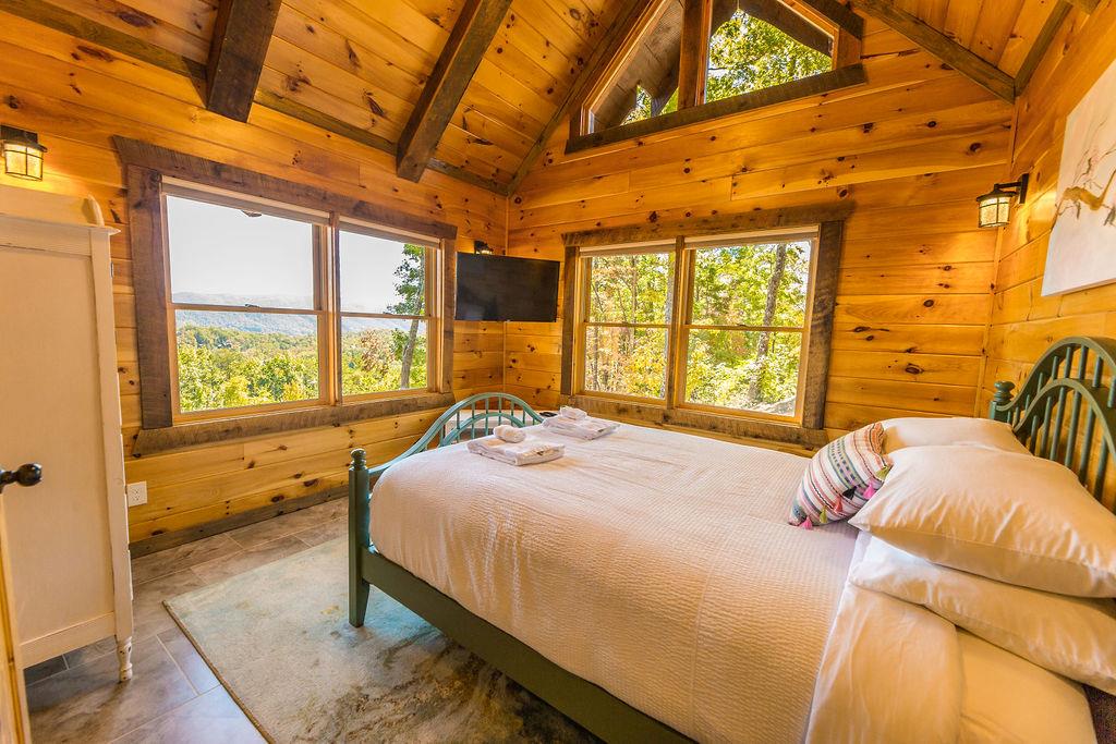 576 Century Blue Ridge Blue Ridge, GA 30513 - Photo 33 of 71 a bedroom with a bed and wooden floor