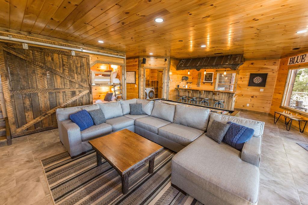 576 Century Blue Ridge Blue Ridge, GA 30513 - Photo 41 of 71 a living room with furniture and a floor to ceiling window next to a large window