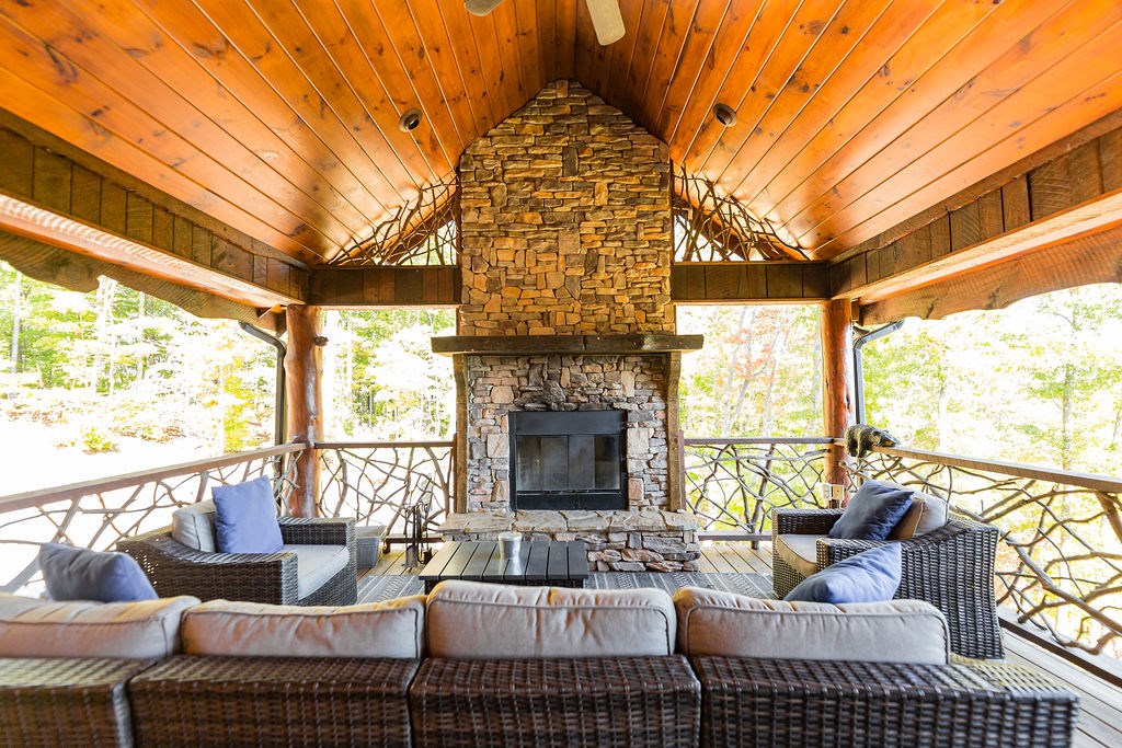 576 Century Blue Ridge Blue Ridge, GA 30513 - Photo 45 of 71 a living room with furniture a fireplace and a large window