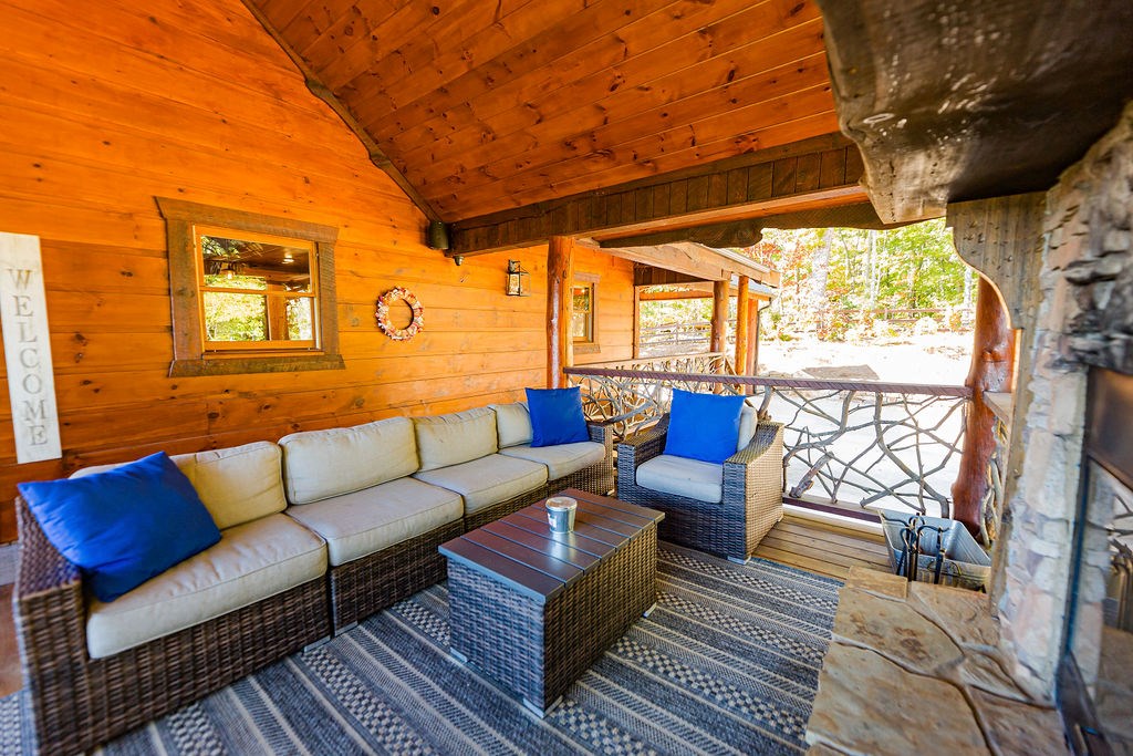 576 Century Blue Ridge Blue Ridge, GA 30513 - Photo 46 of 71 a roof deck with couch and wooden floor