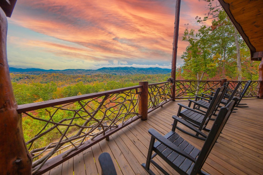 576 Century Blue Ridge Blue Ridge, GA 30513 - Photo 5 of 71 a view of a balcony with wooden floor next to a lake