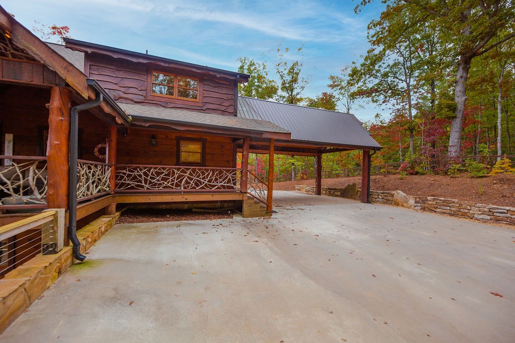 576 Century Blue Ridge Blue Ridge, GA 30513 - Photo 69 of 71 a view of house with a yard and hanging chair
