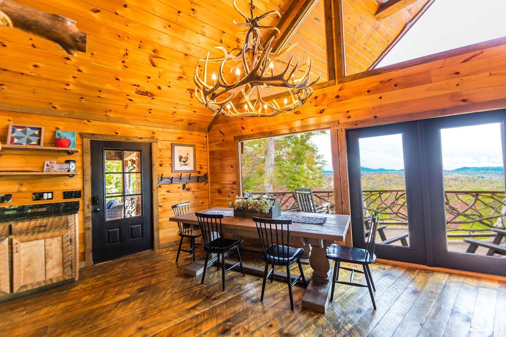 576 Century Blue Ridge Blue Ridge, GA 30513 - Photo 9 of 71 a view of a dining room with furniture window and wooden floor