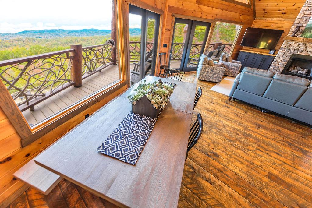 576 Century Blue Ridge Blue Ridge, GA 30513 - Photo 10 of 71 a outdoor living room with furniture floor to ceiling windows and a flat screen tv