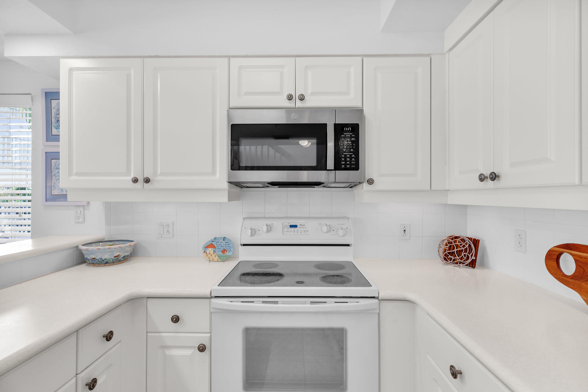 95 Coco Plum Drive, Unit 5A Marathon, FL 33050 - Photo 13 of 34 a kitchen with appliances a sink and cabinets