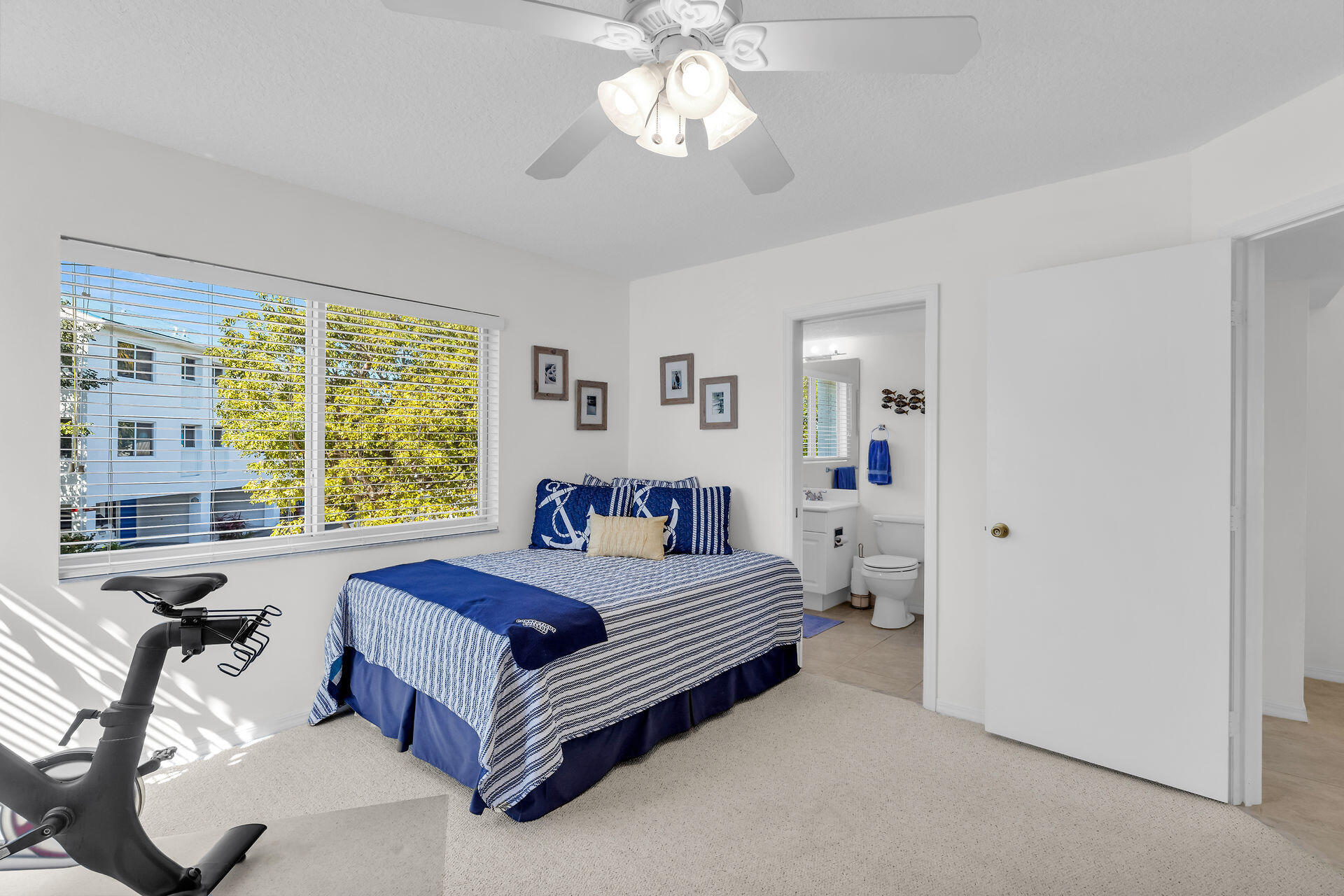 95 Coco Plum Drive, Unit 5A Marathon, FL 33050 - Photo 15 of 34 a living room with a bed furniture and a large window