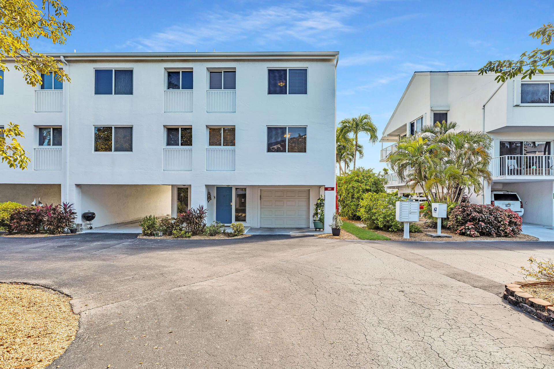 95 Coco Plum Drive, Unit 5A Marathon, FL 33050 - Photo 2 of 34 a view of a building with many windows and potted plants