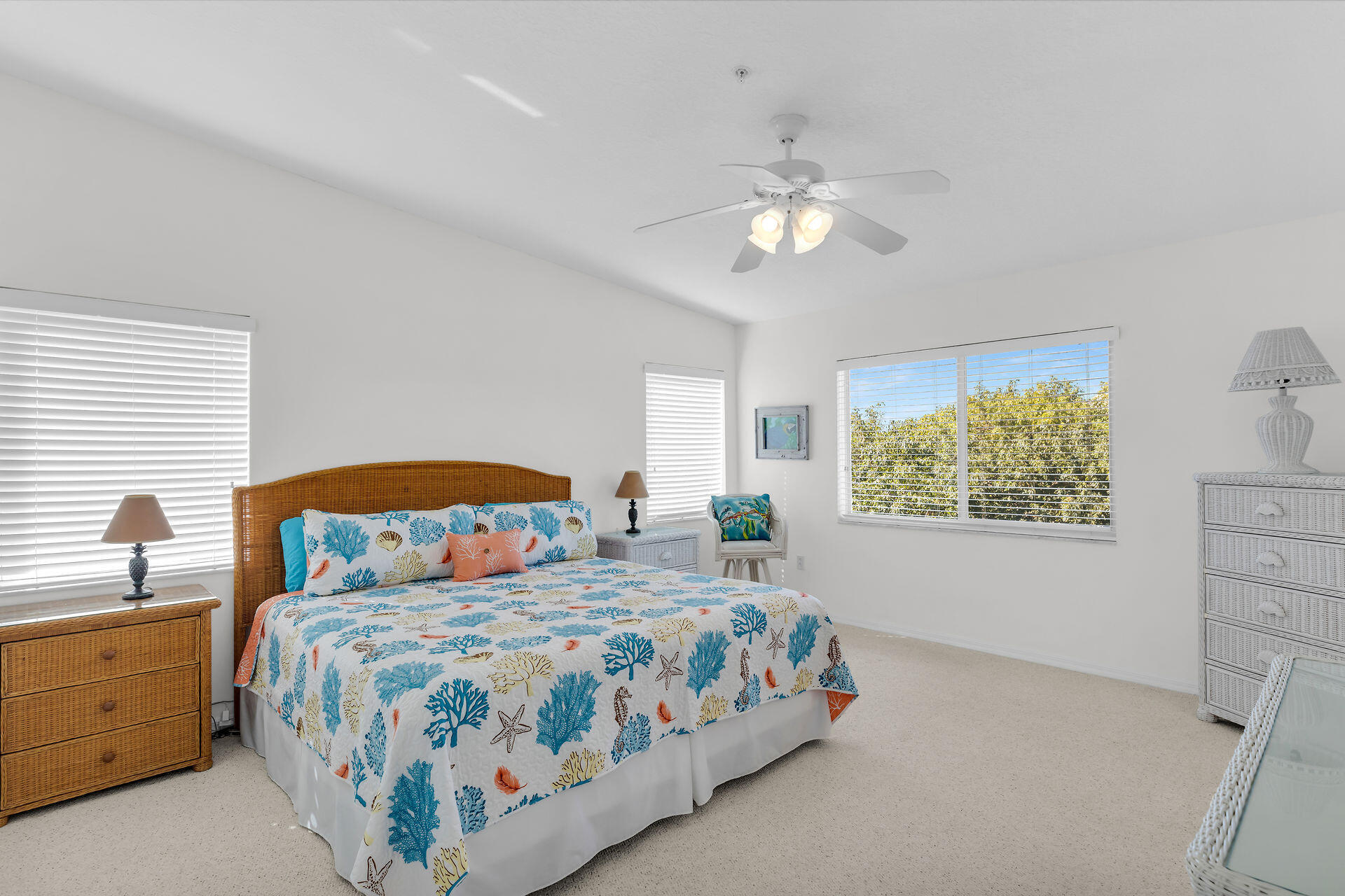 95 Coco Plum Drive, Unit 5A Marathon, FL 33050 - Photo 23 of 34 a bedroom with a large bed and a chandelier