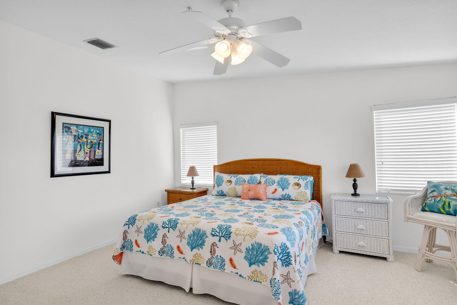 95 Coco Plum Drive, Unit 5A Marathon, FL 33050 - Photo 24 of 34 a bedroom with a bed and a chandelier