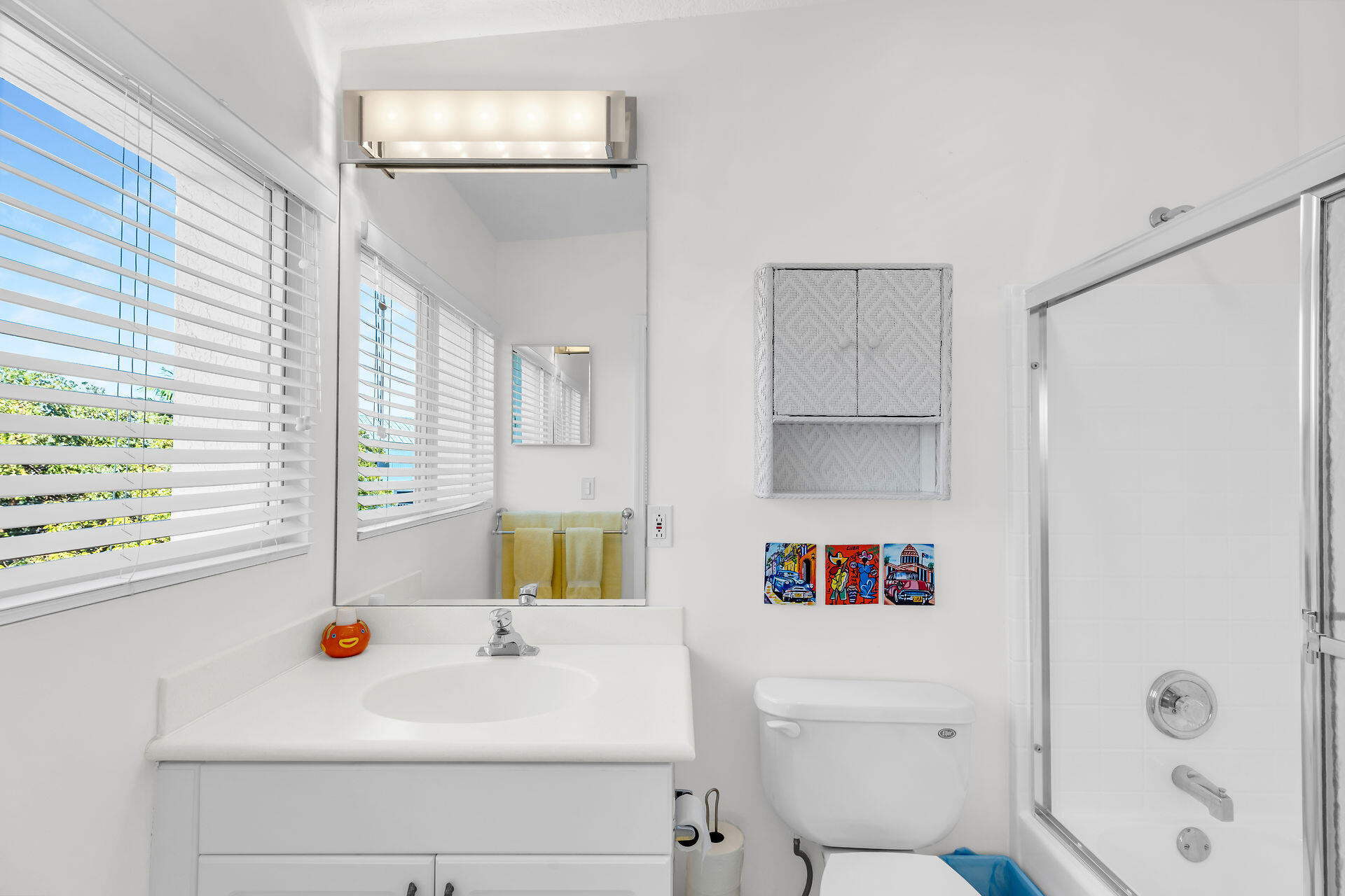 95 Coco Plum Drive, Unit 5A Marathon, FL 33050 - Photo 25 of 34 a bathroom with a sink and a shower curtain