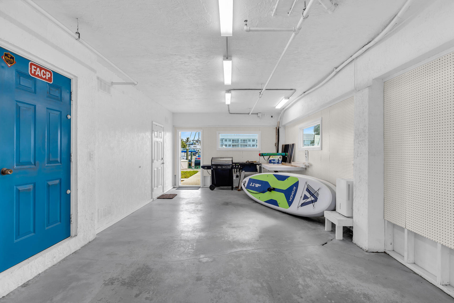 95 Coco Plum Drive, Unit 5A Marathon, FL 33050 - Photo 27 of 34 a view of a room with window fridge and a window