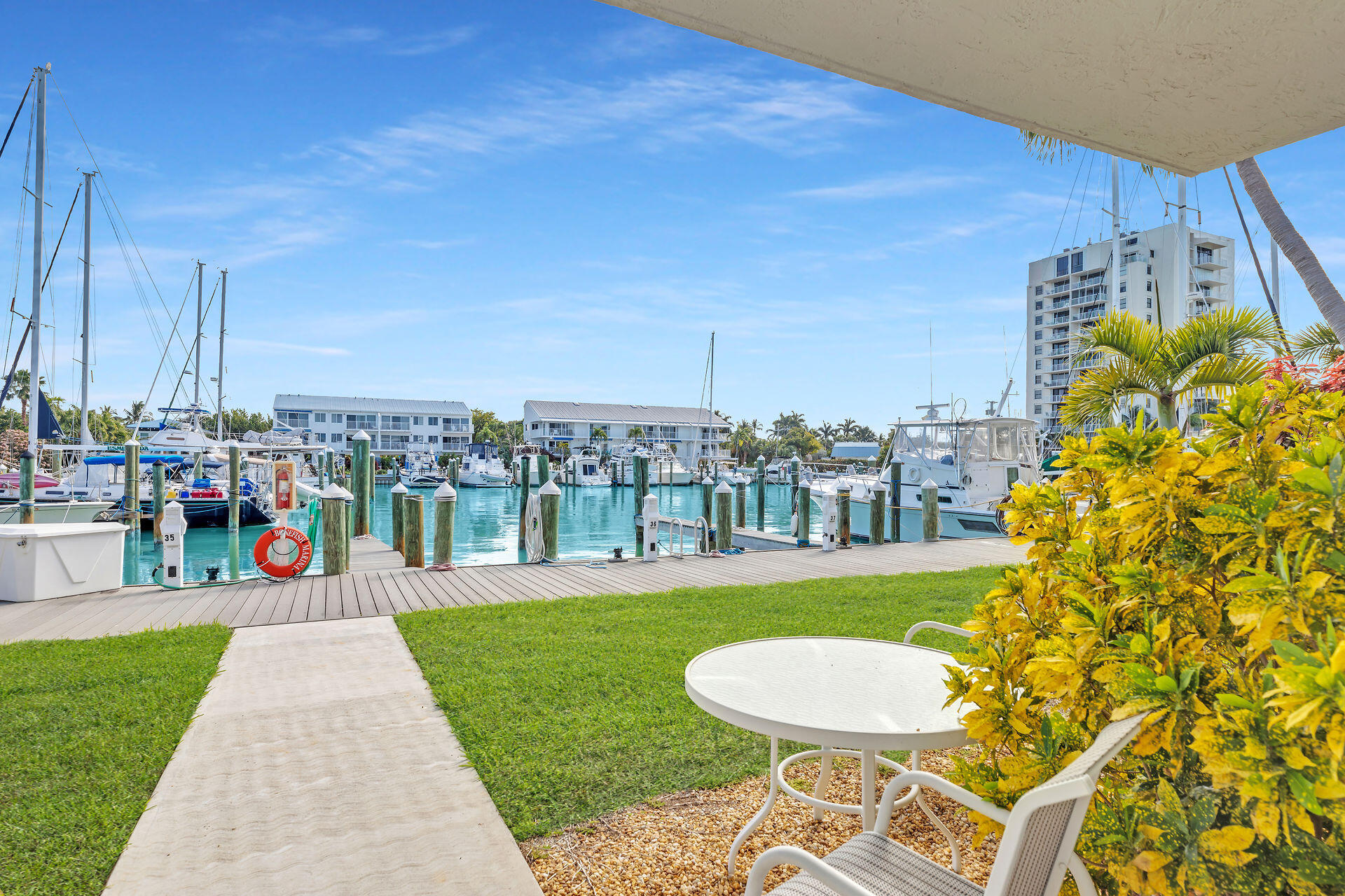 95 Coco Plum Drive, Unit 5A Marathon, FL 33050 - Photo 28 of 34 a front view of a house with a yard