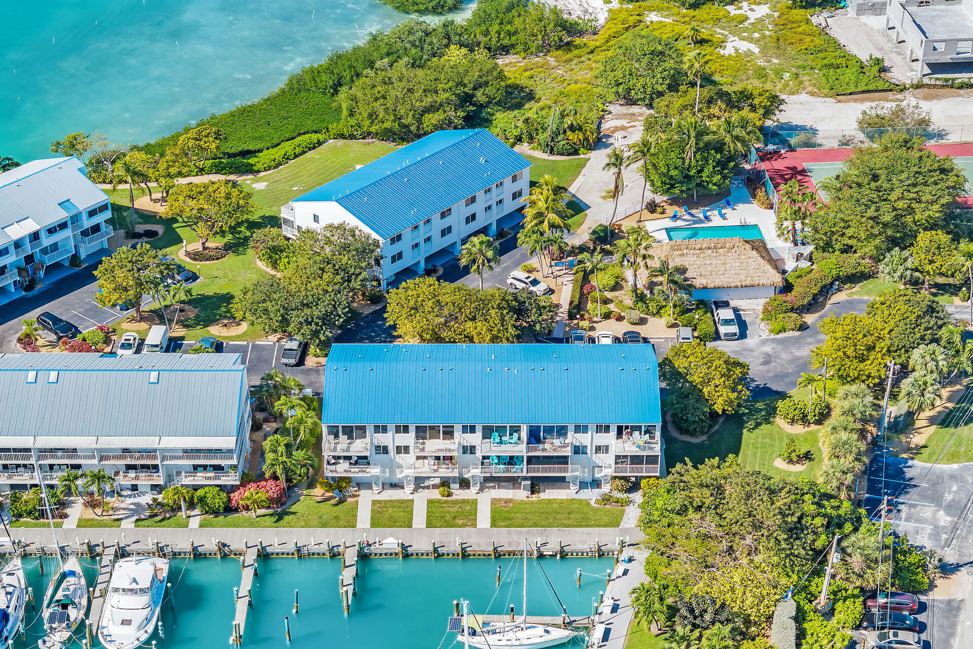 95 Coco Plum Drive, Unit 5A Marathon, FL 33050 - Photo 3 of 34 a view of a swimming pool with outdoor seating