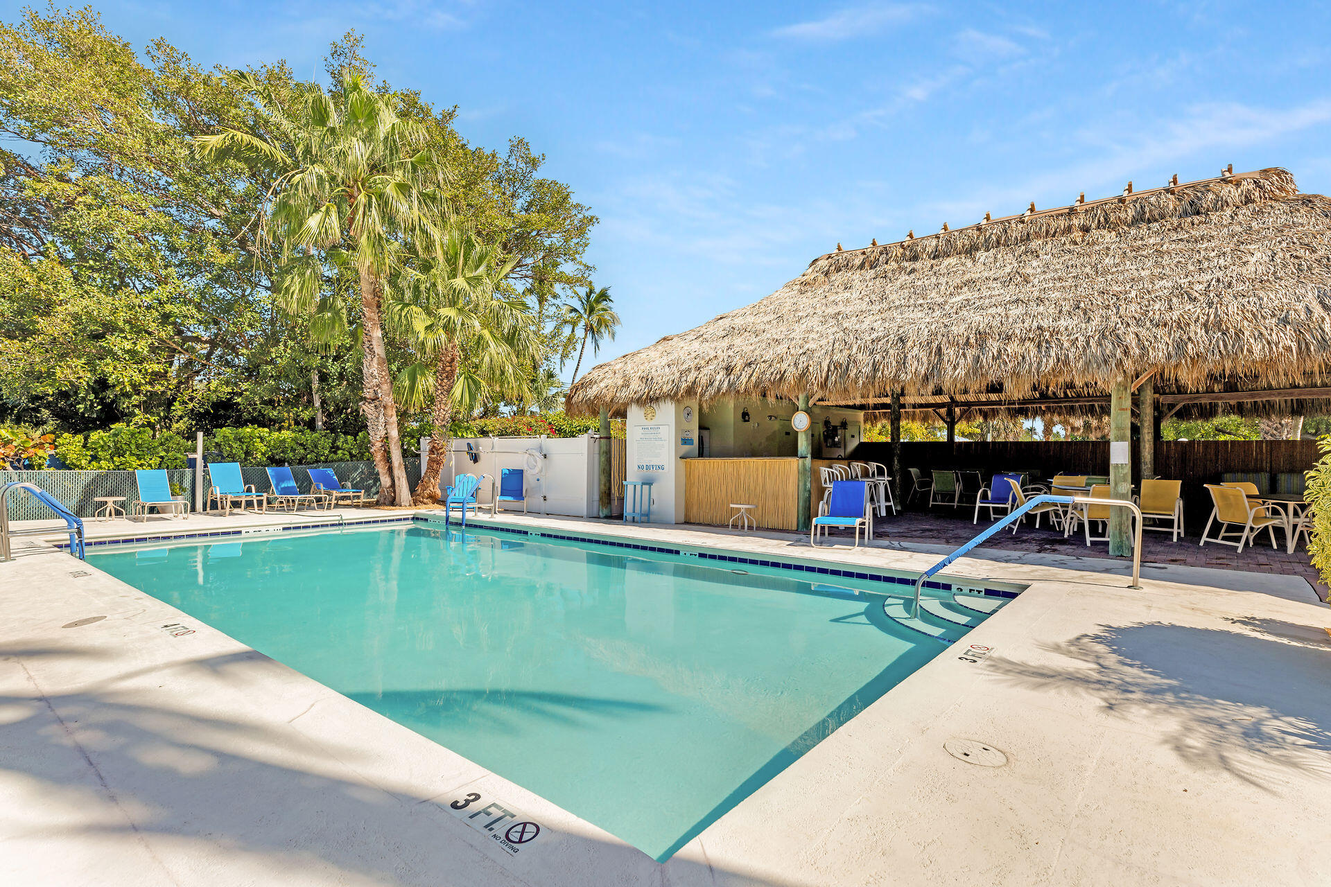 95 Coco Plum Drive, Unit 5A Marathon, FL 33050 - Photo 33 of 34 a view of a swimming pool with a patio