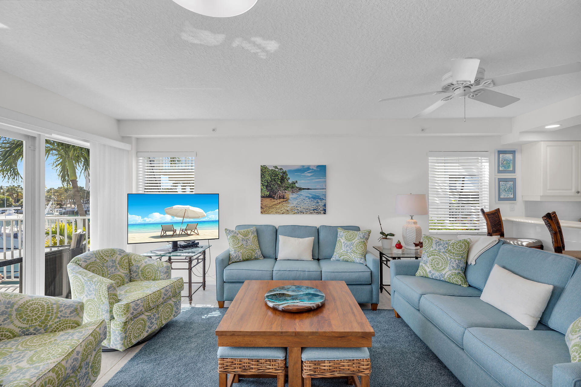 95 Coco Plum Drive, Unit 5A Marathon, FL 33050 - Photo 7 of 34 a living room with furniture a rug potted plant and a window