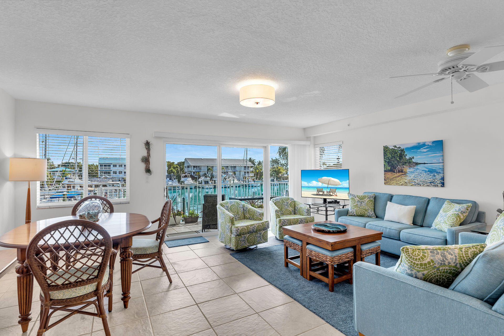95 Coco Plum Drive, Unit 5A Marathon, FL 33050 - Photo 8 of 34 a living room with furniture and a floor to ceiling window