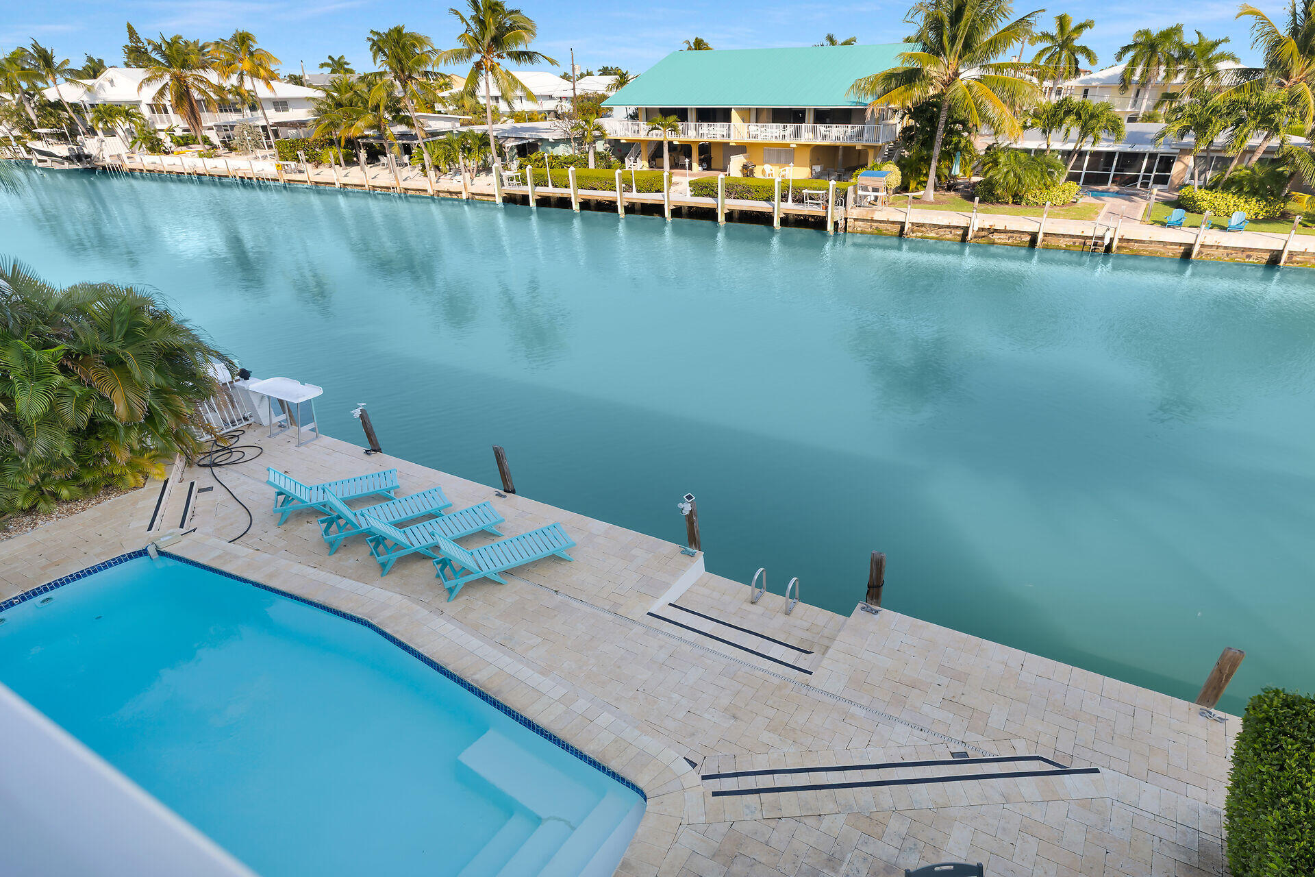 580-590 10th Street Key Colony Beach, FL 33051 - Photo 9 of 75 a view of a lake with a table and chairs