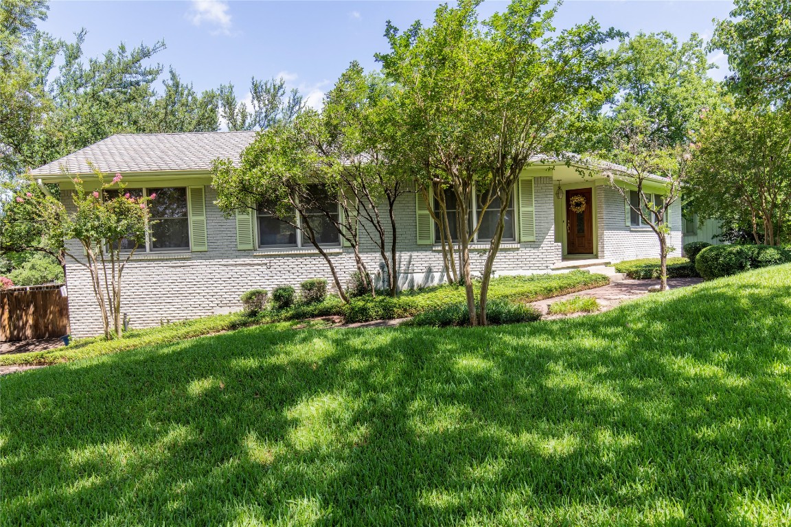 3300 Exposition Boulevard Austin, TX 78703 - Photo 1 of 1 a view of a house with a backyard and a tree