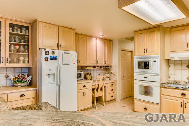 810 25 Road Grand Junction, CO 81505 - Photo 4 of 9 a kitchen with stainless steel appliances a refrigerator sink and cabinets