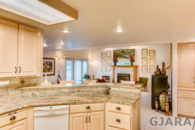 810 25 Road Grand Junction, CO 81505 - Photo 5 of 9 a kitchen with granite countertop a sink cabinets and stainless steel appliances