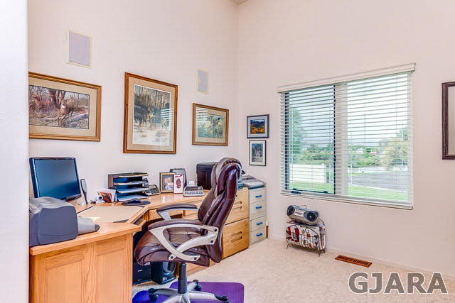 810 25 Road Grand Junction, CO 81505 - Photo 9 of 9 a view of a workspace with furniture and a window