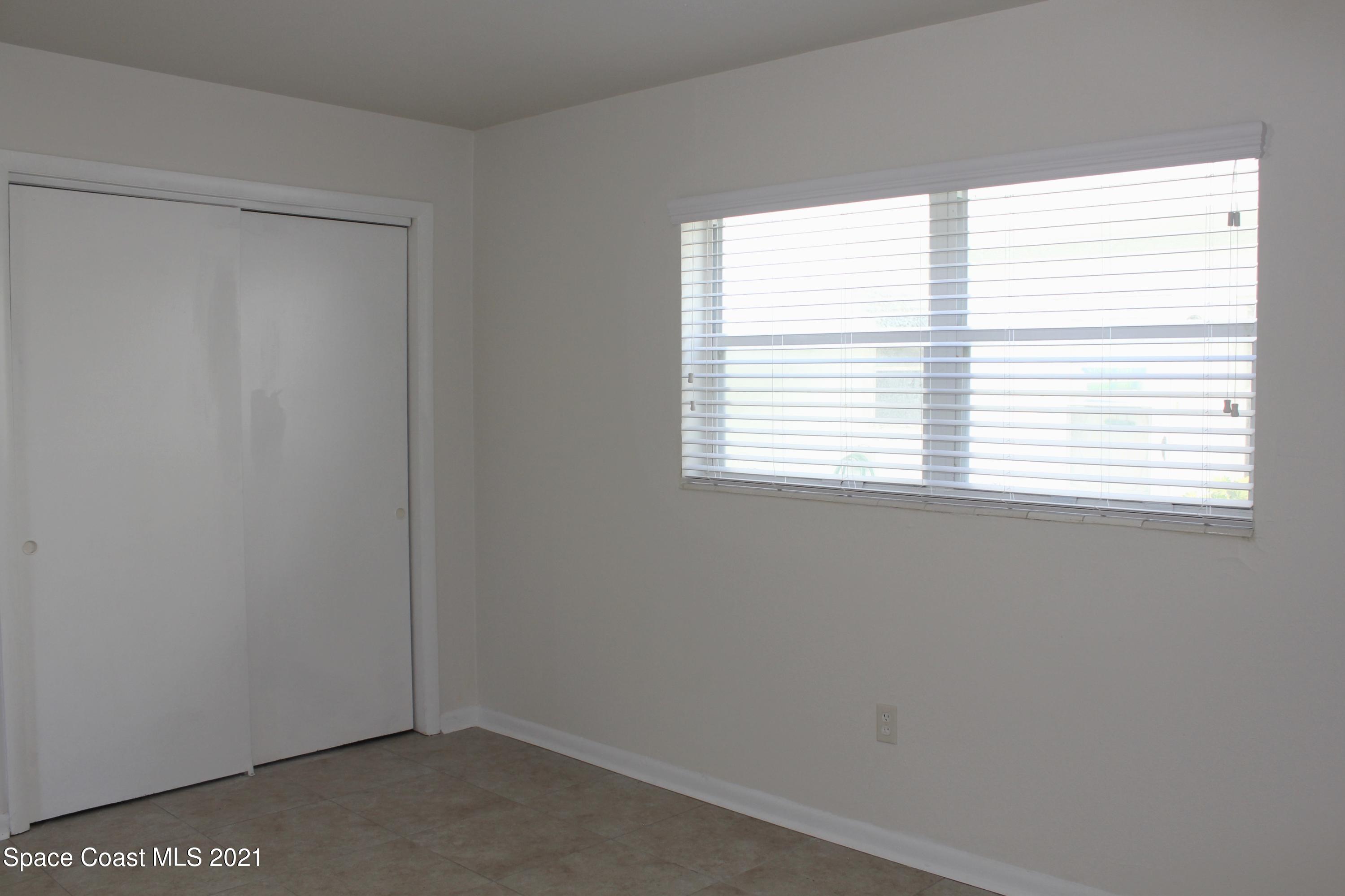 651 Palm Drive, Unit E1 Satellite Beach, FL 32937 - Photo 14 of 18 a small space with a window