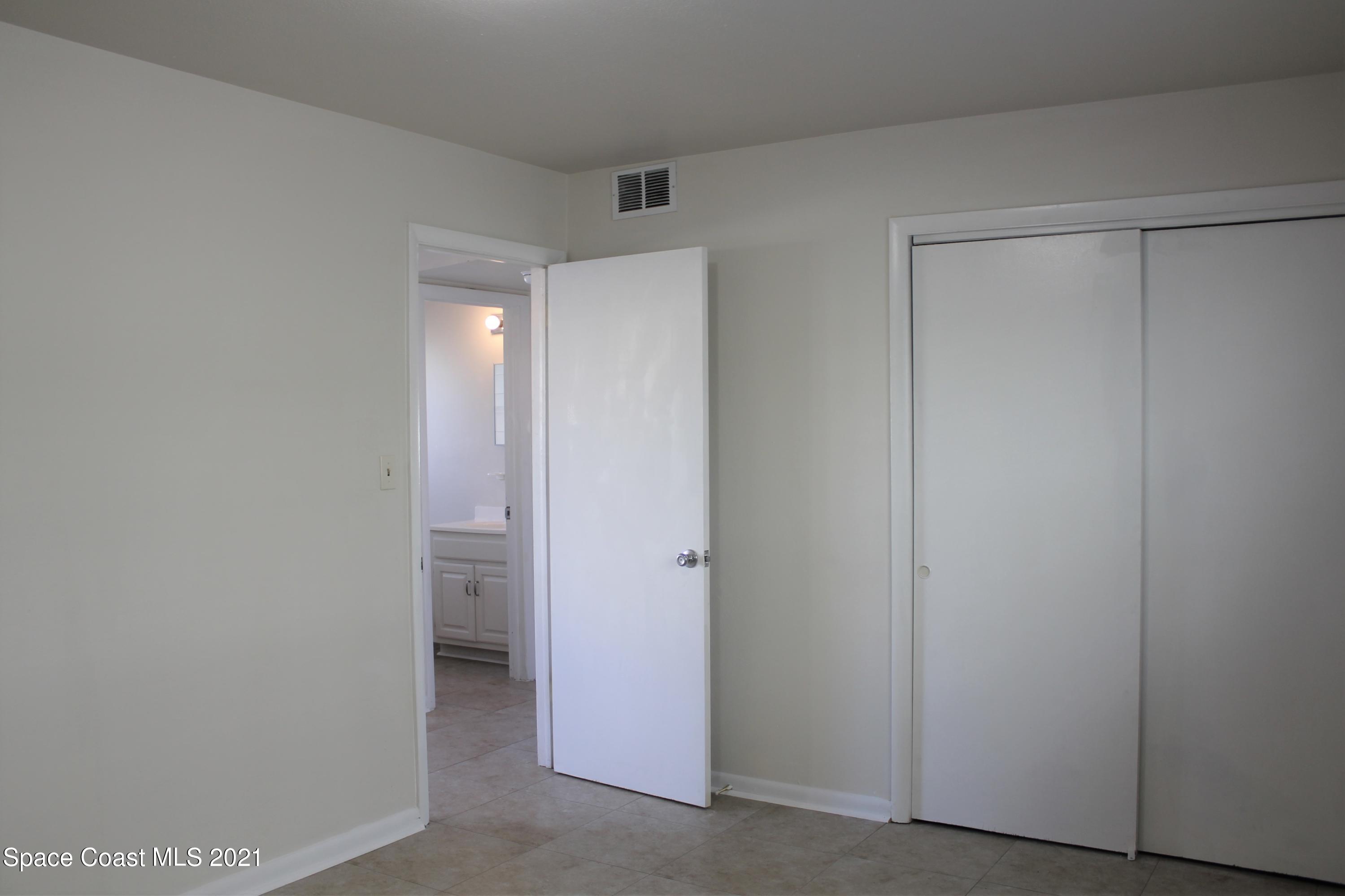 651 Palm Drive, Unit E1 Satellite Beach, FL 32937 - Photo 15 of 18 a view of an empty room