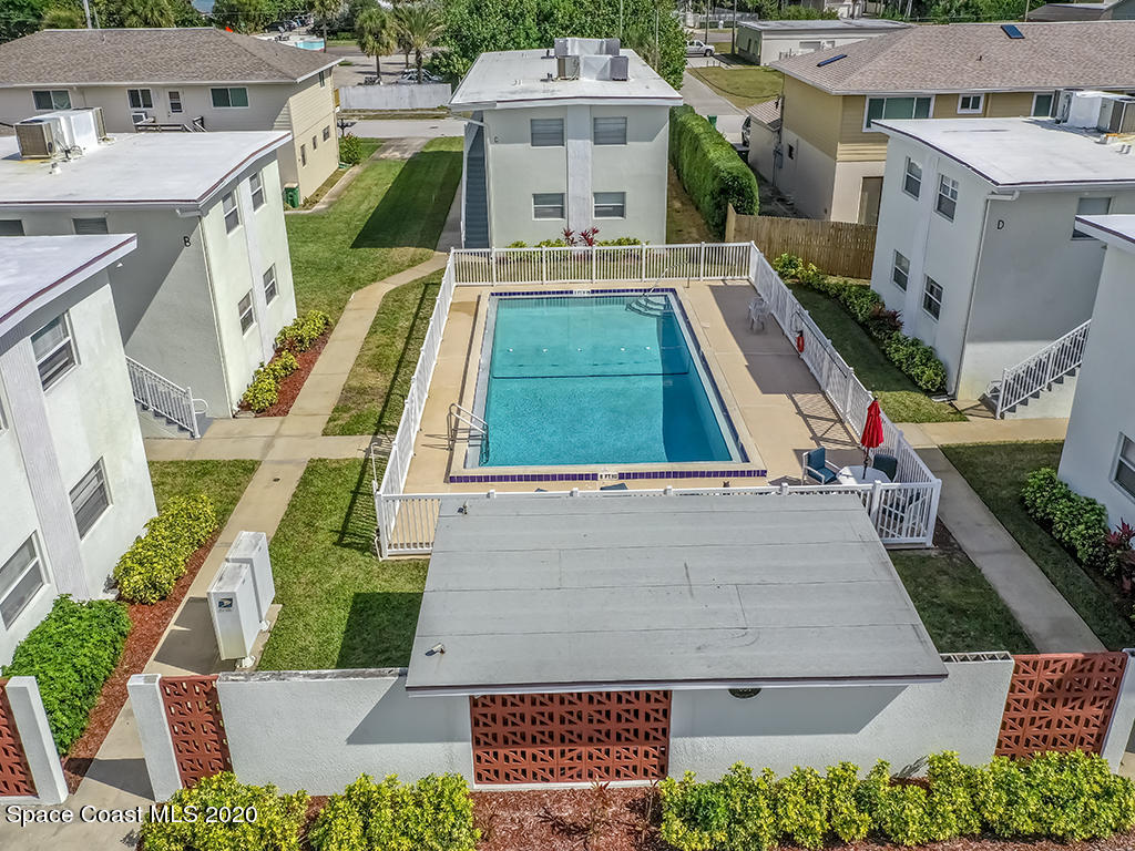 651 Palm Drive, Unit E1 Satellite Beach, FL 32937 - Photo 4 of 18 an aerial view of a house with swimming pool
