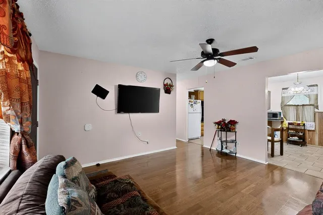 a room with furniture and a flat screen tv