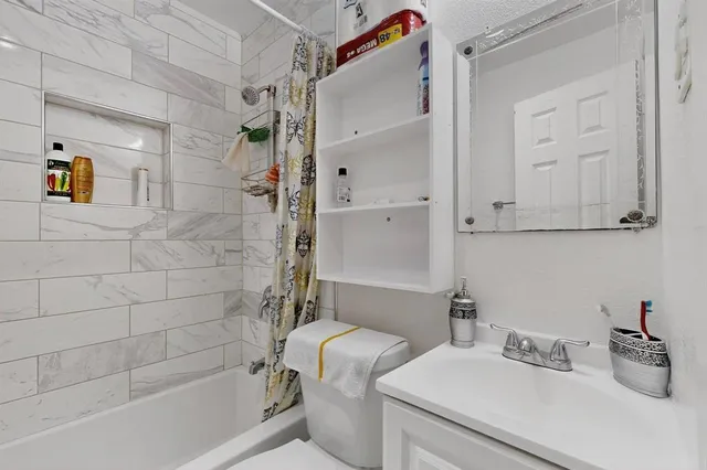 a bathroom with a sink and a shower