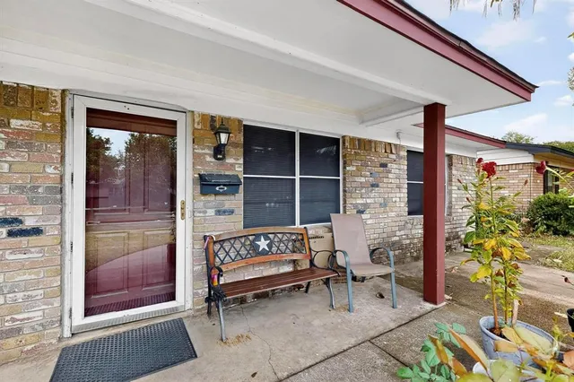 a outdoor living space with patio furniture and a potted plant